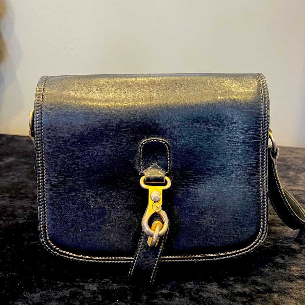 Vintage GUCCI handbag. Great condition, black with gold accents.